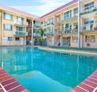 Bribie Beach King bed Unit overlooking pool - New Castle Holiday