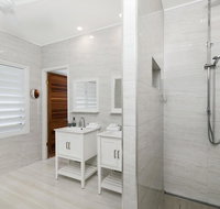 Bathers across the bay from Port Douglas - New Castle Holiday